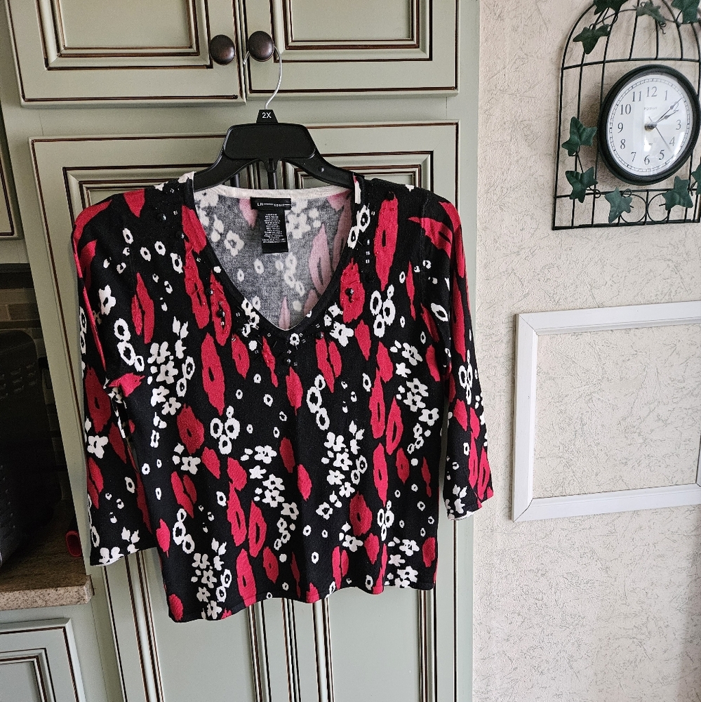 Nice ladies sport top size large.. Black sparkle beads on front.